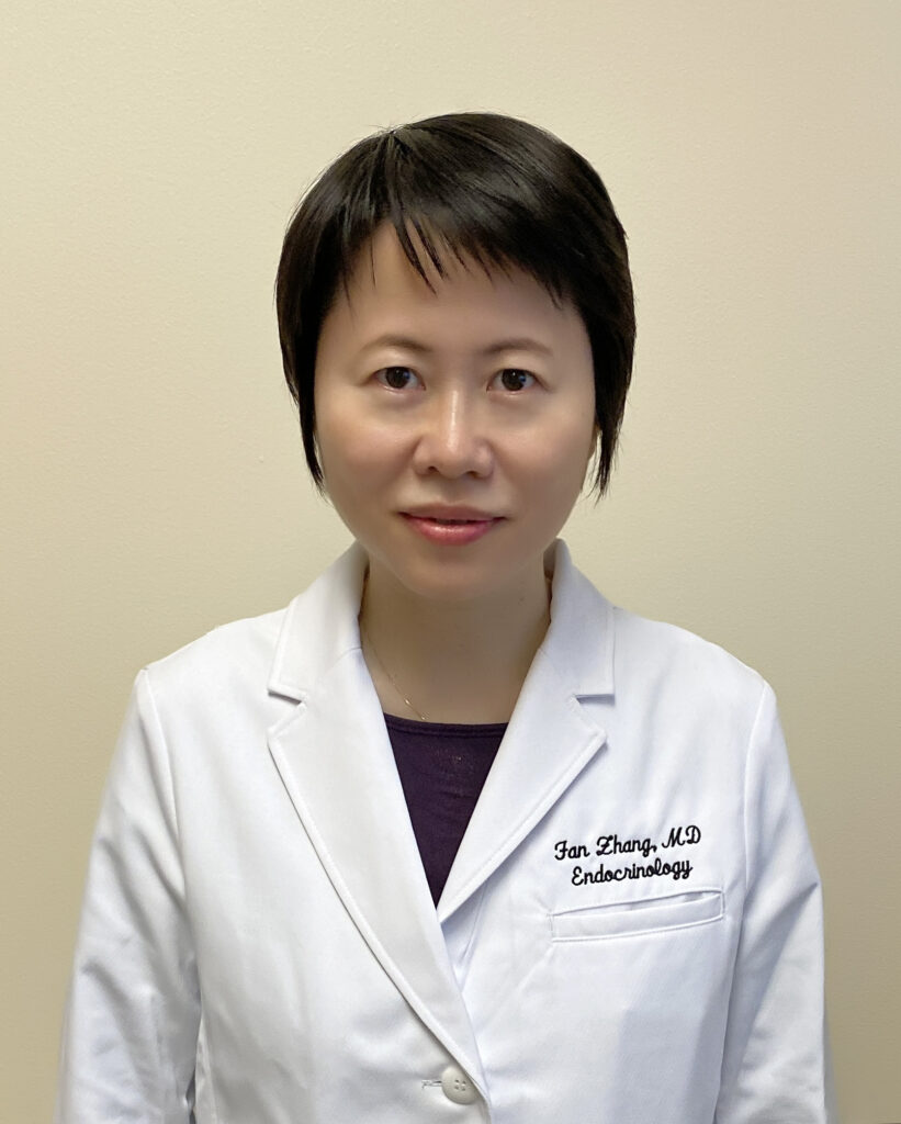 Headshot of Dr. Fan Zhang in white coat